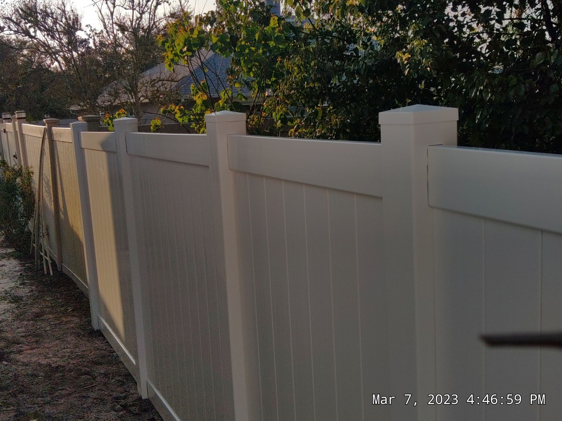 Fence Installation using White Vinyl by Hip Square Fence Inc.