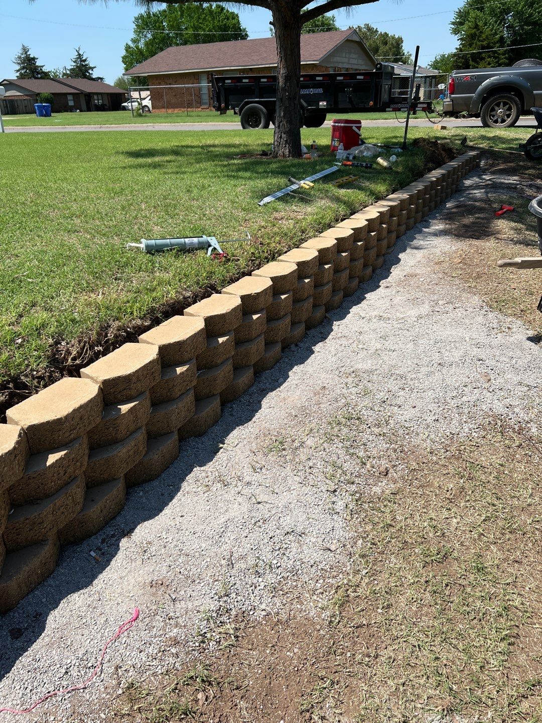 Retaining Wall using Rocks by Clays Services Inc