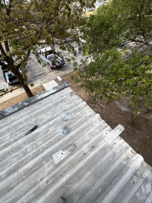 View of corrugated metal roof with installation hardware