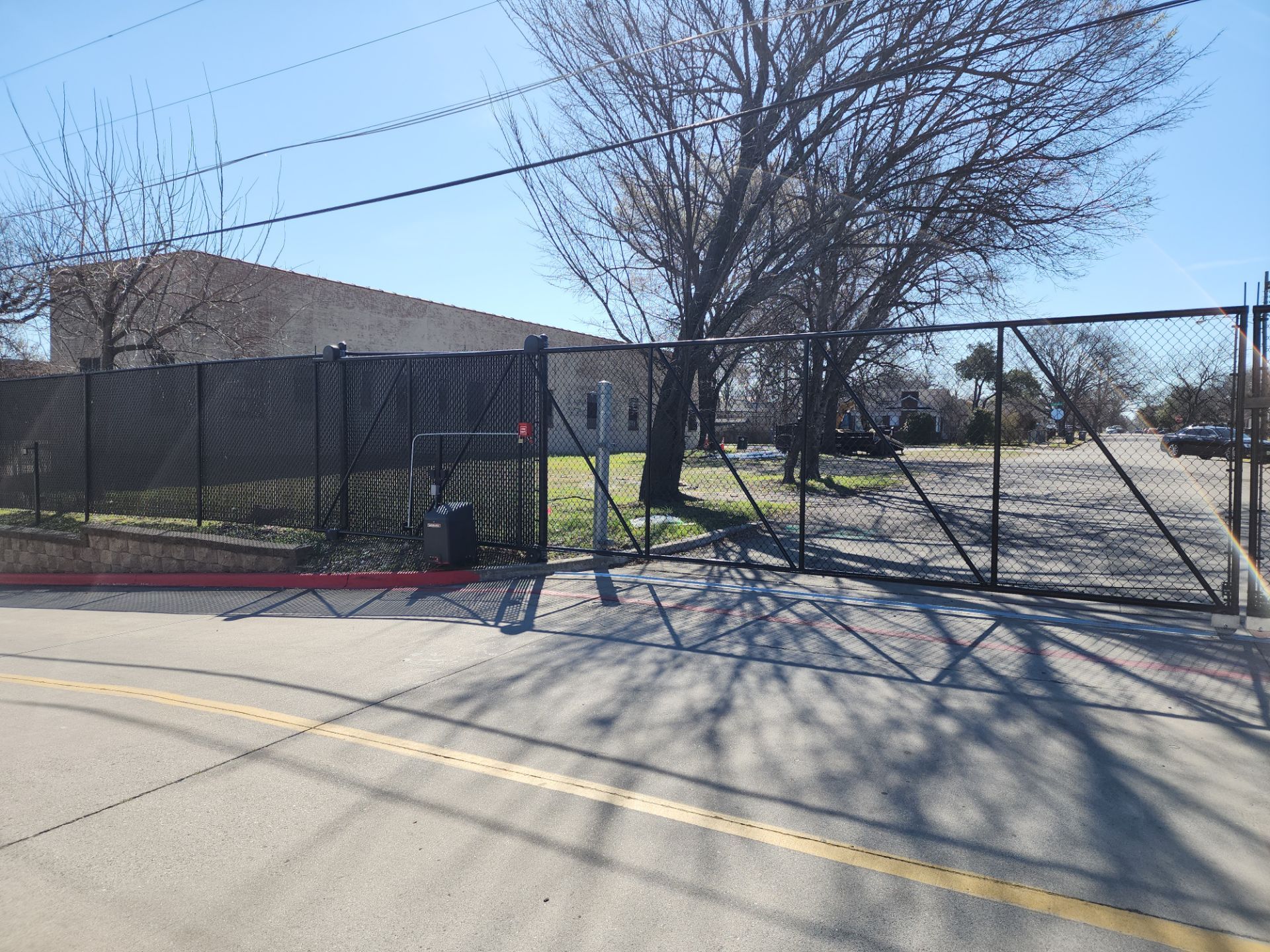 Commercial Fencing - Black vinyl coated Chain link Fence by 3:16 Roofing and Construction