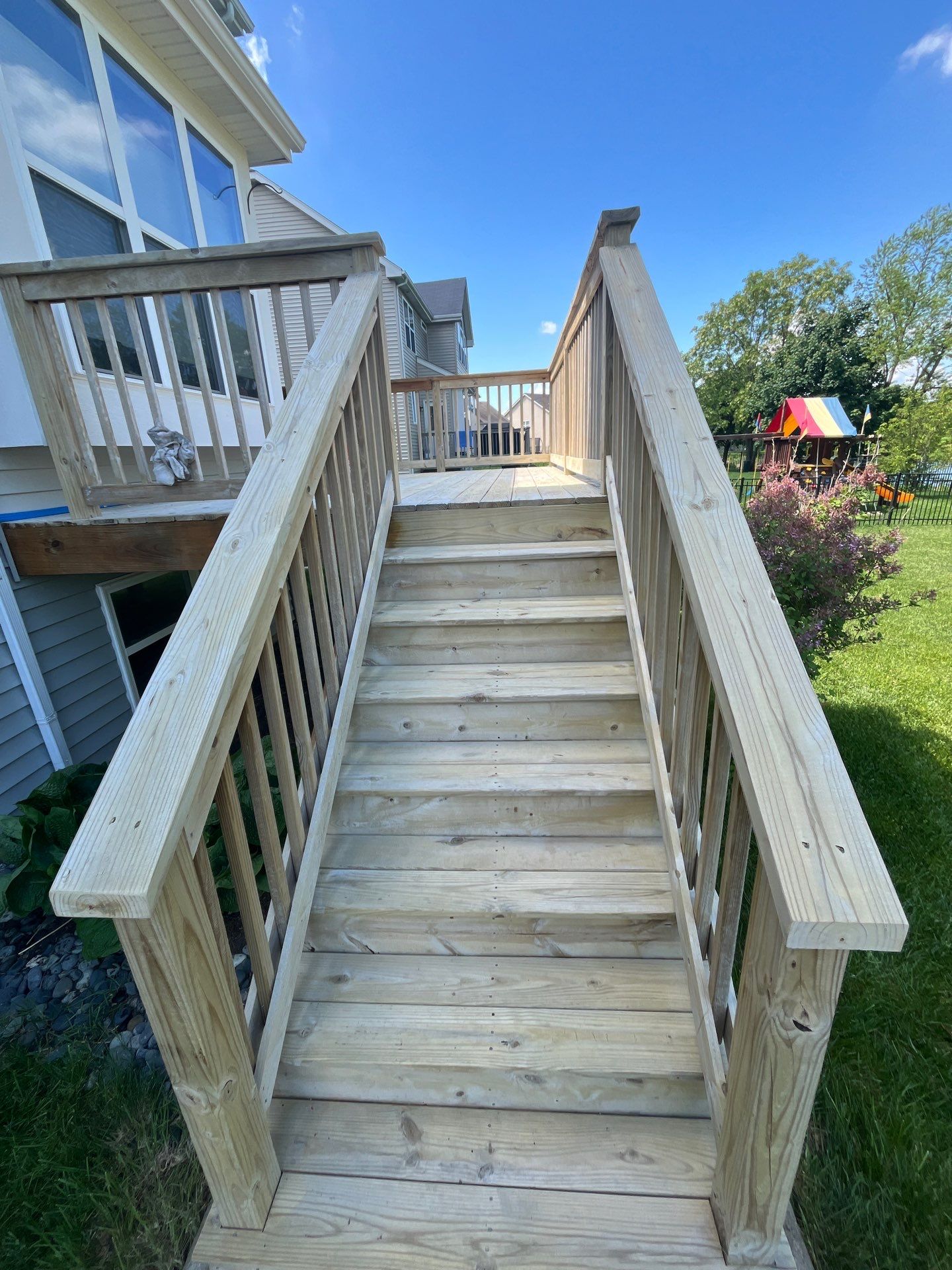 wood deck cleaning and staining by Northern Power Washing LLC.