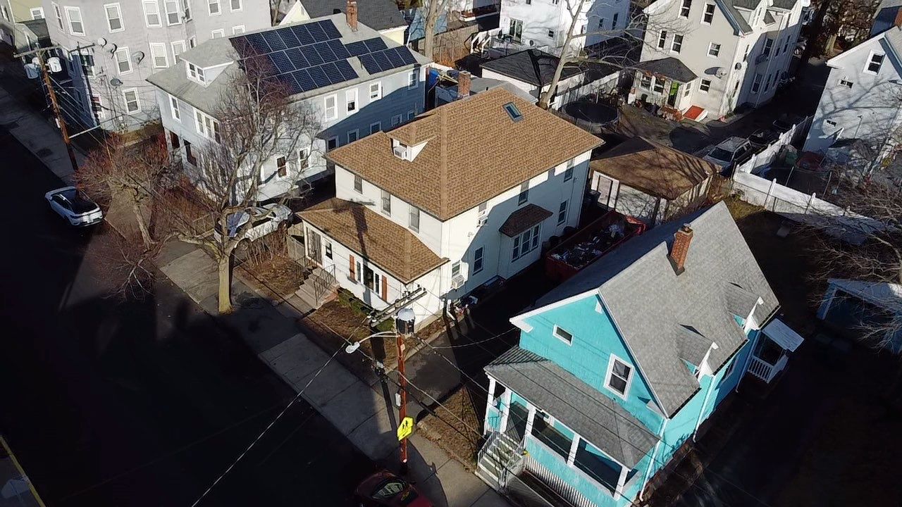 Roof Installation Roof Type: Hip Roof  Multi Family Home- 2 Story by Delarosa Construction & Design