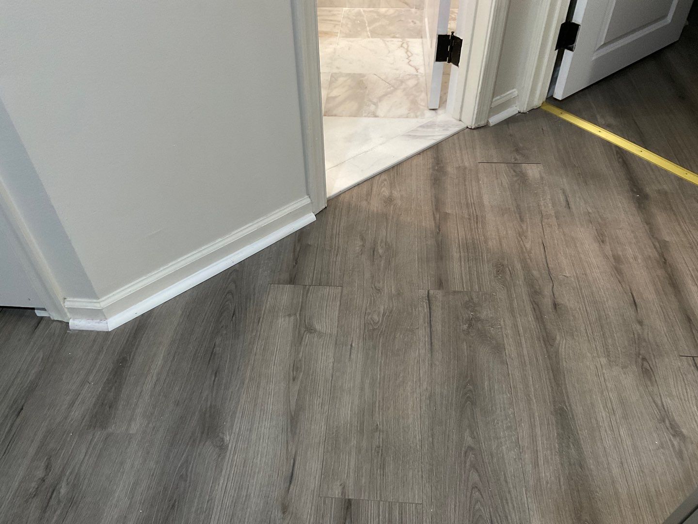 Bathroom Remodel using Two new bathroom design and new floors by Alpha Design Services