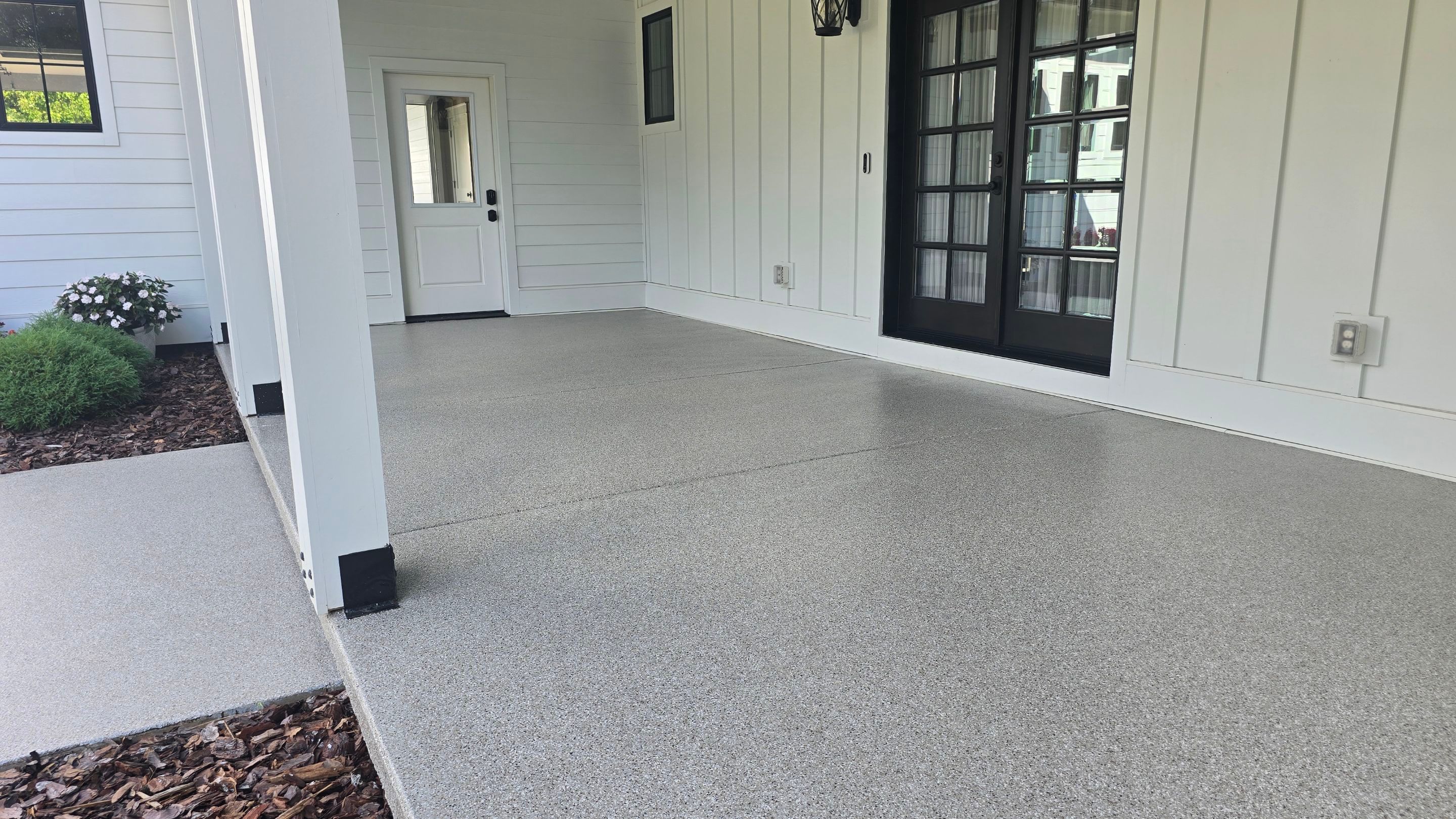 Front Porch & Garage Using Creekbed by Elite Floor Solutions