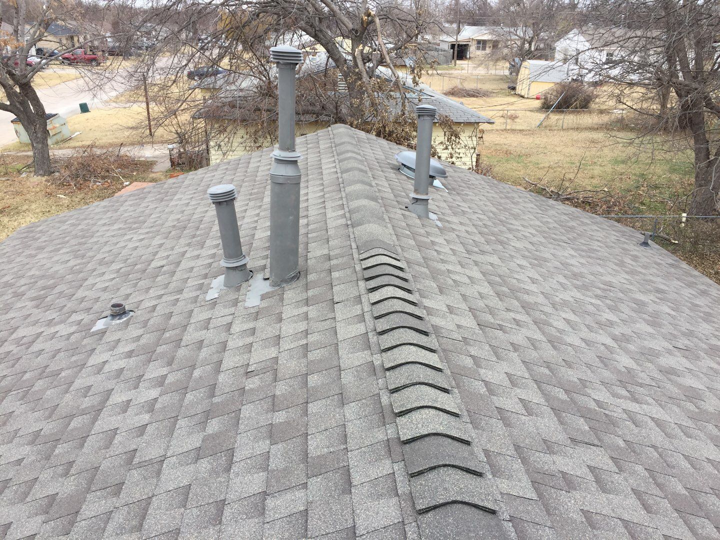 vent stack & solar tube in Warr Acres by McCann's Roofing and Construction