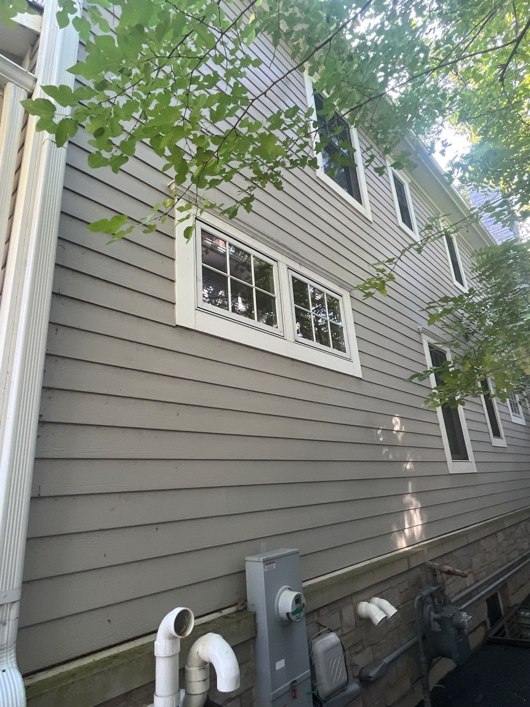 Hardie Board House & Detached Garage Soft Washing by Northern Power Washing LLC.