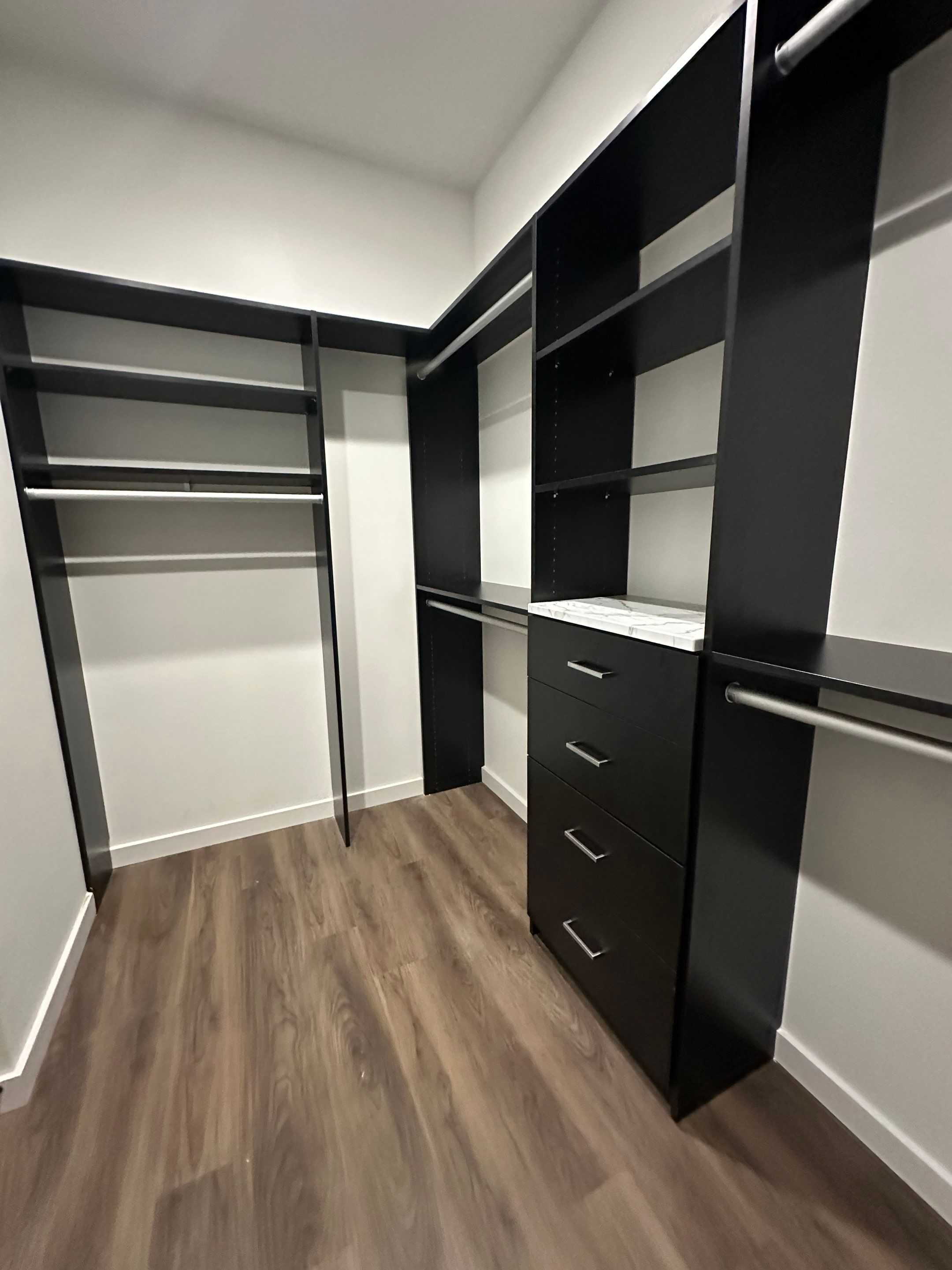 Custom Black Laminate Walk-In Closet Installation in Tampa by Square 1 Garage and Closet Solutions