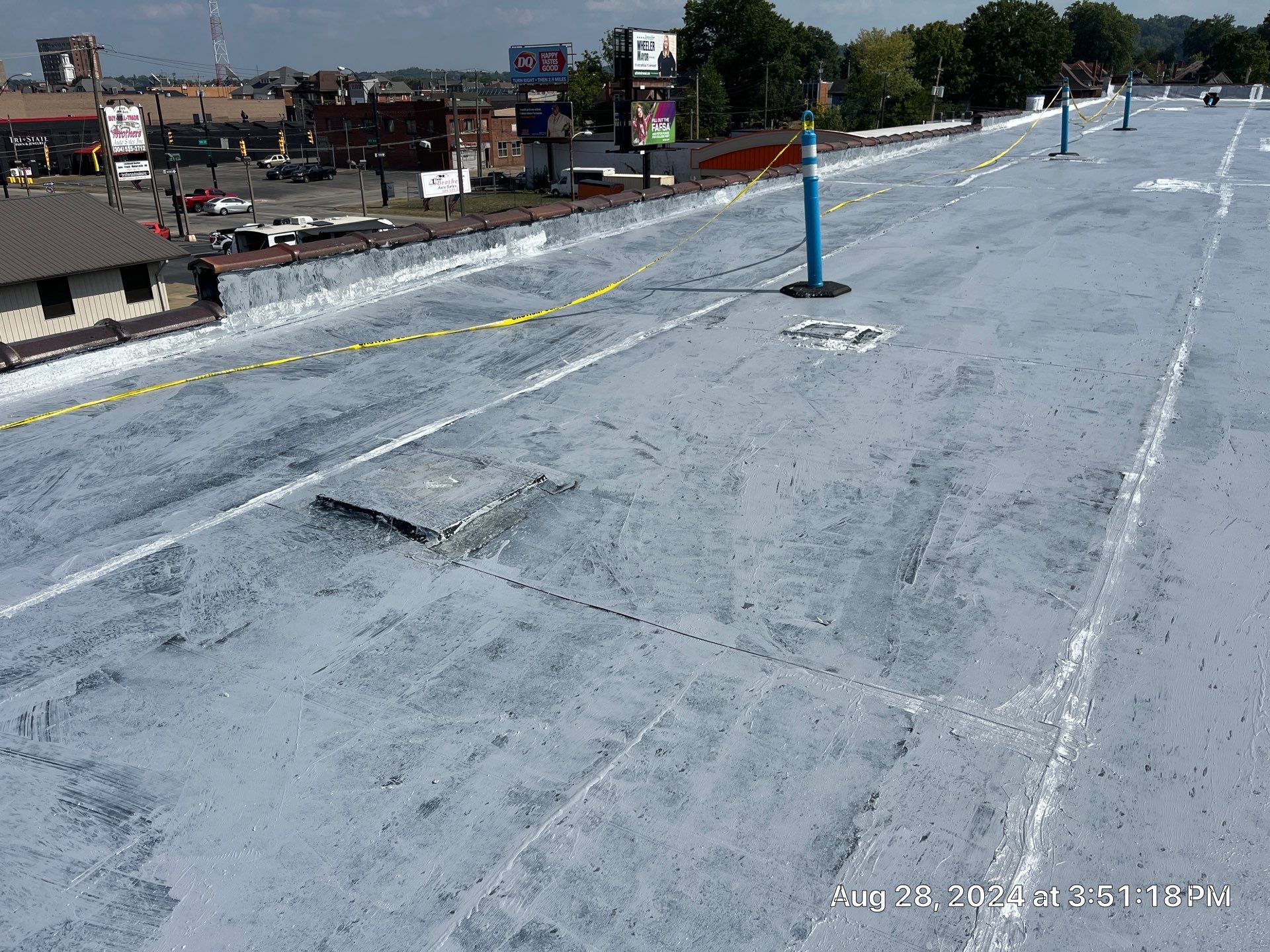 Commercial Roofing Installation using smartcoat Roof coating by Fahey Roofing + Contracting