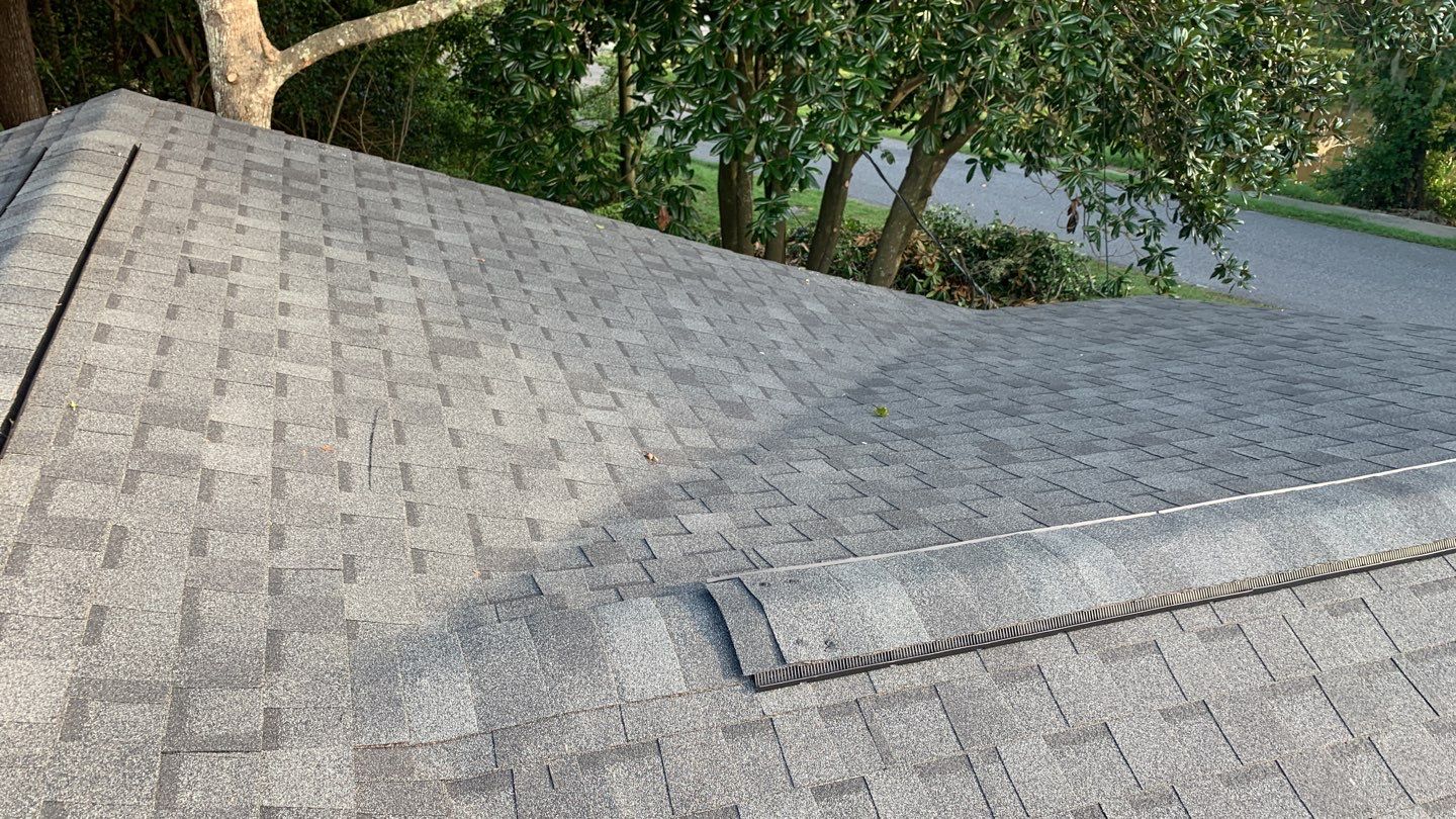Hail Damage using Atlas Pristine Pinnacle Shingles by Artigues Roofing & Restoration Services
