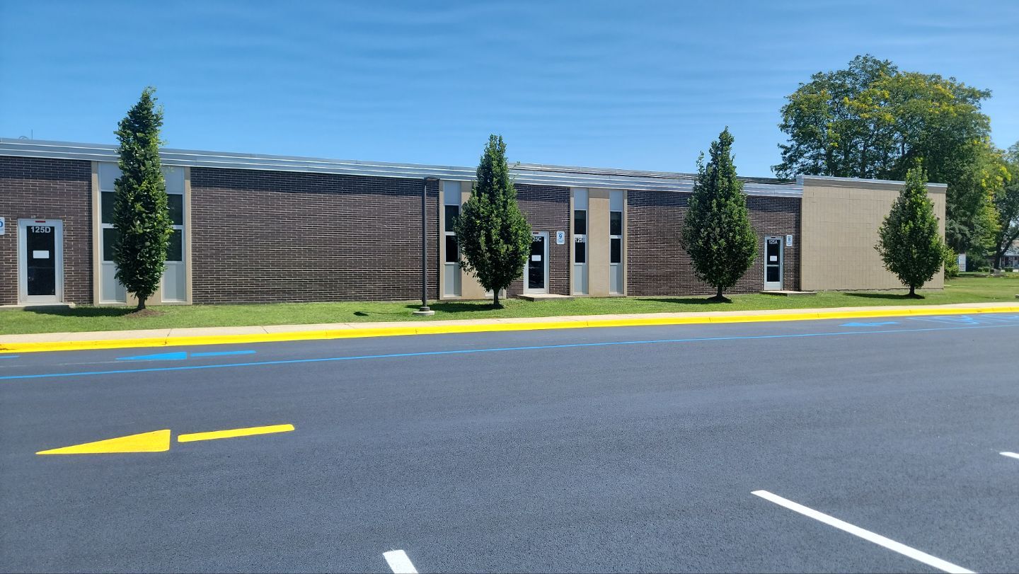 commercial pressure washing using Algaecide, soft wash soap by Northern Power Washing LLC.