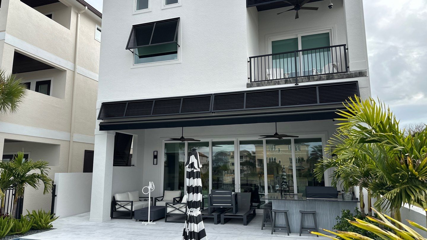 Bahama Shutters in Jet Black by Smart Guard Shutters