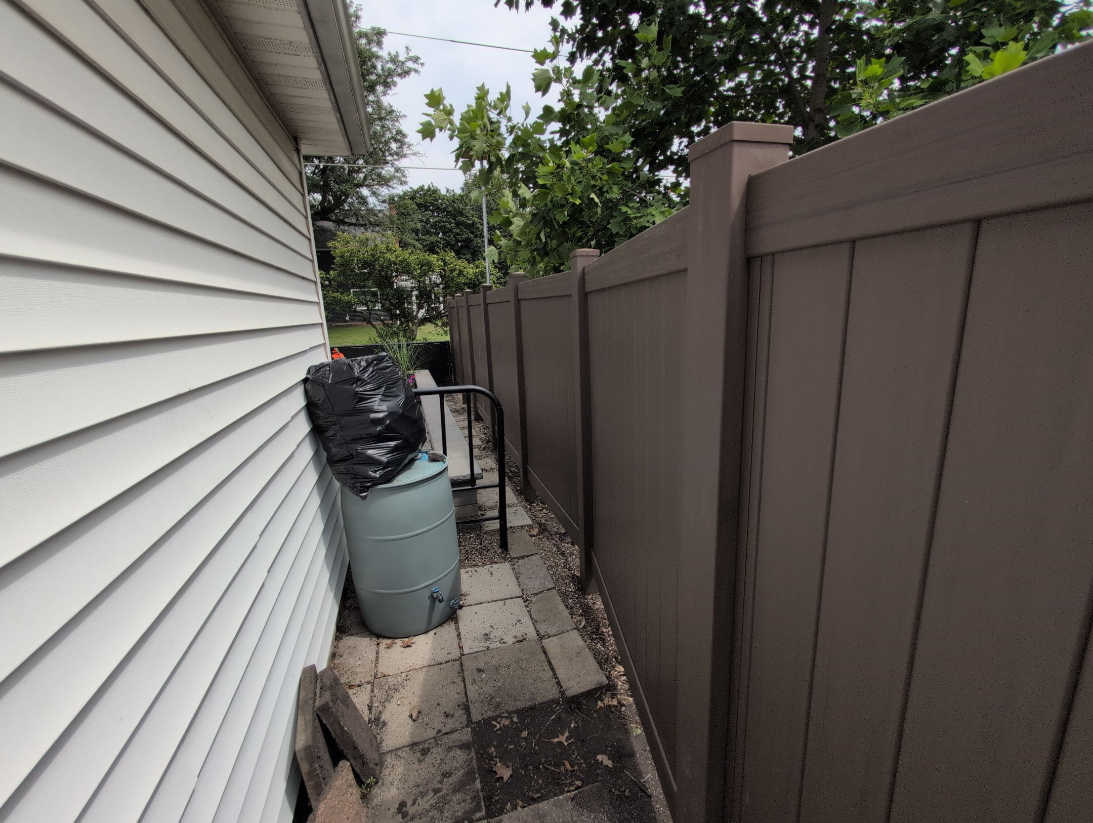 Walnut Vinyl Privacy Fence Installation in Waterloo by Perfect Picket Fence and Stain