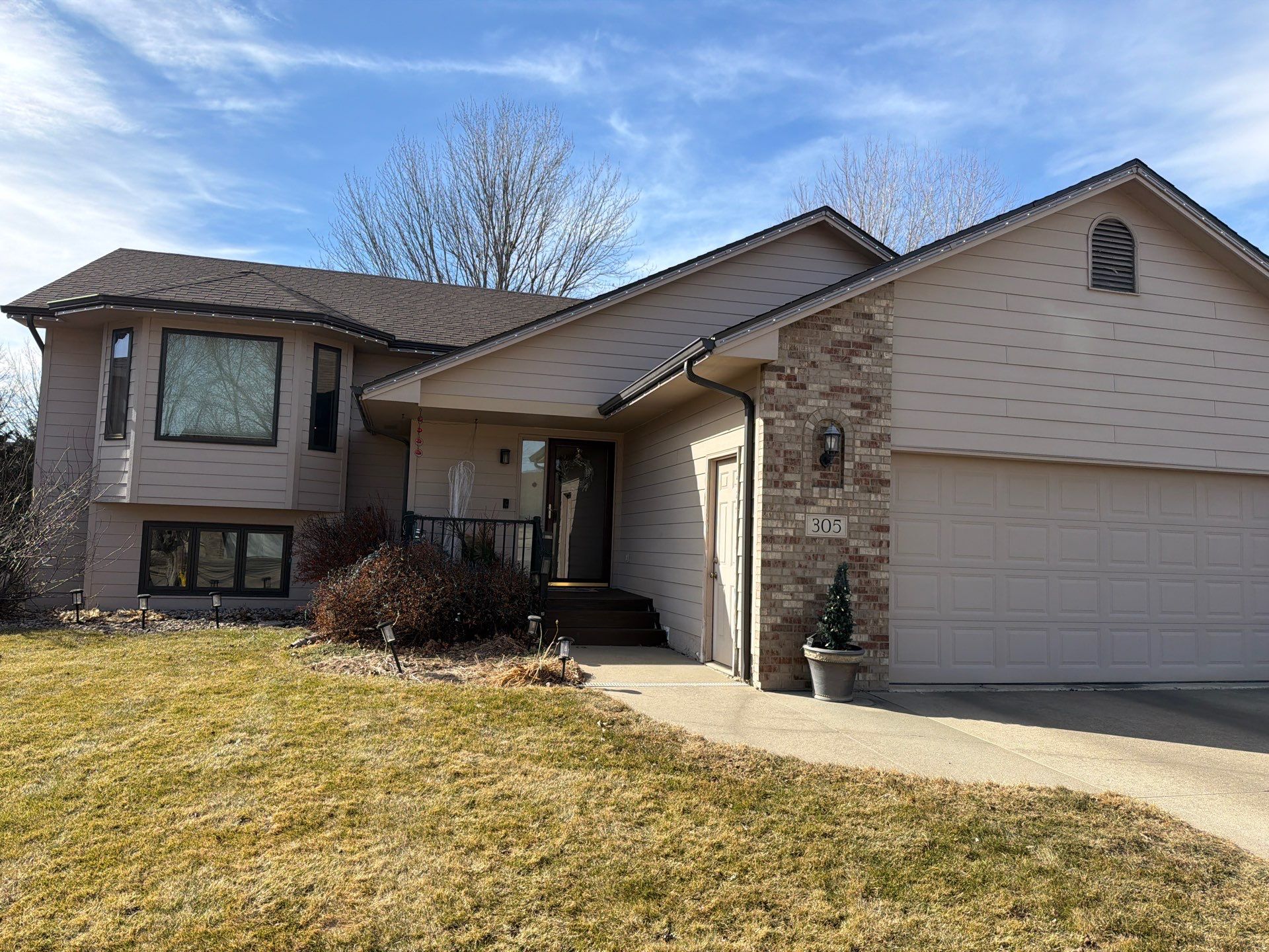 Residential Exterior Painting and Trim Restoration in Sioux Falls by Select Painting, Coatings & Garage Cabinets