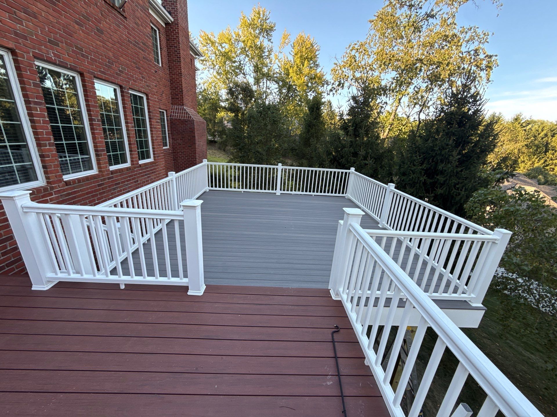Deck extension  by Cousins Roofing Siding & Decks