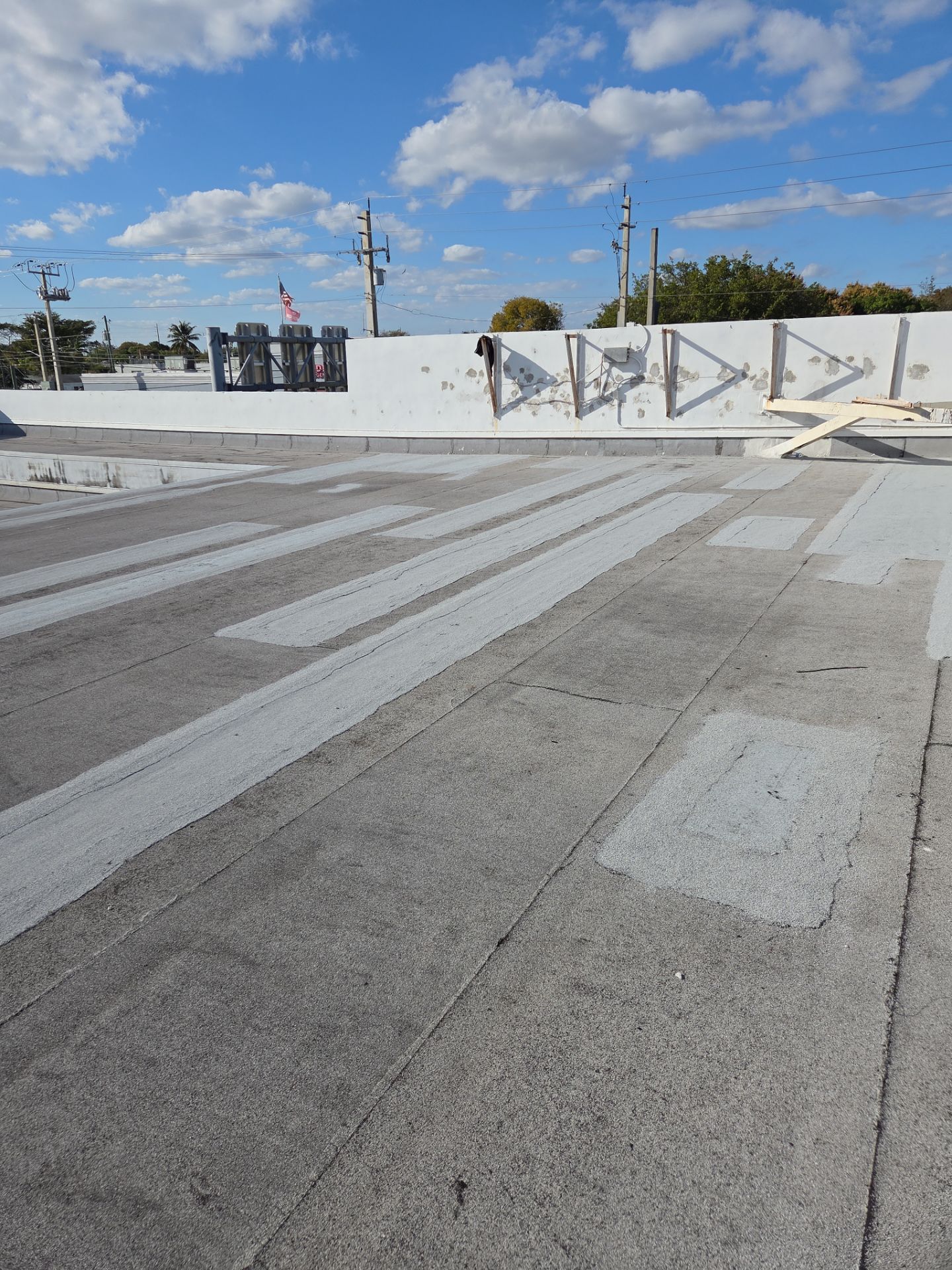 Commercial Flat Roof Restoration Using Silicone Coating in Hallandale Beach by Aastro Roofing