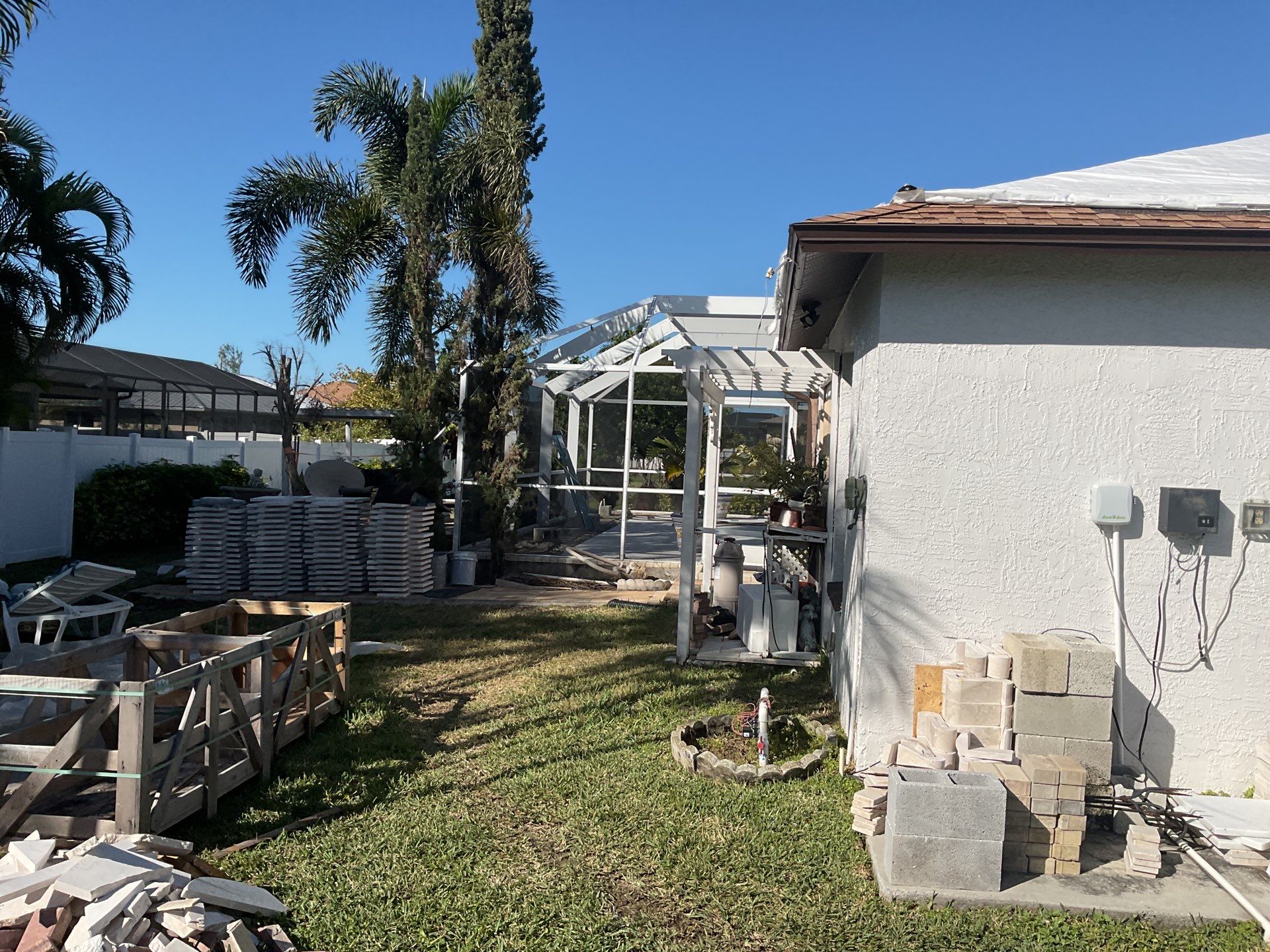 Brown Gutter + White and Brown Downspouts in Cape Coral FL by Gutter Professors