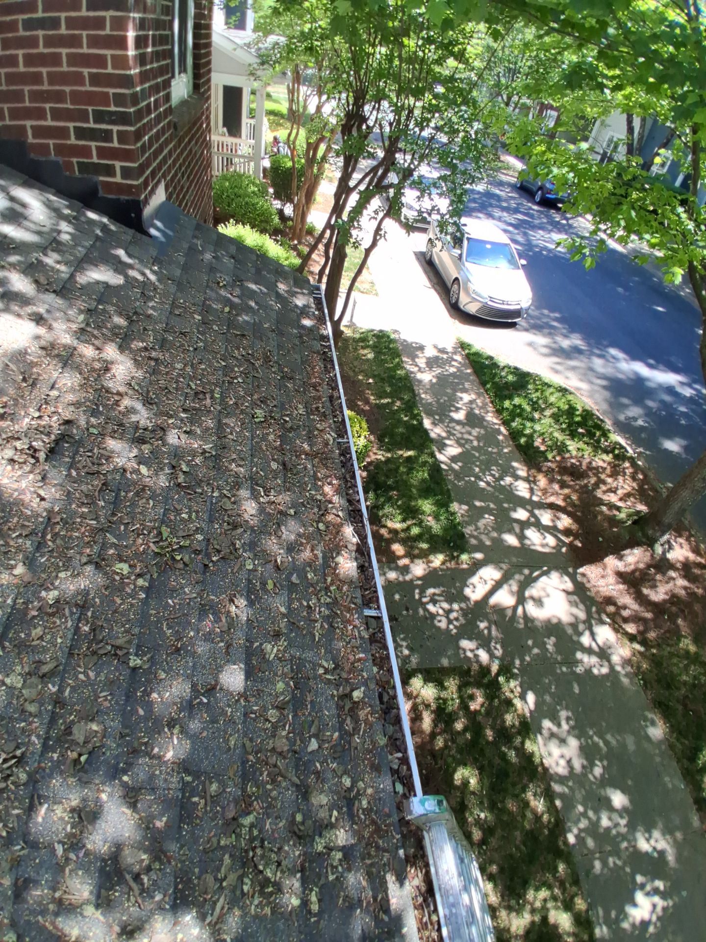 Commercial gutter cleaning Huntersville & Cornelius, NC before photo with filled gutters