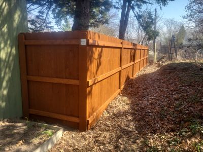 Stained Cedar Wood Privacy Fence Installation in Cedar Falls