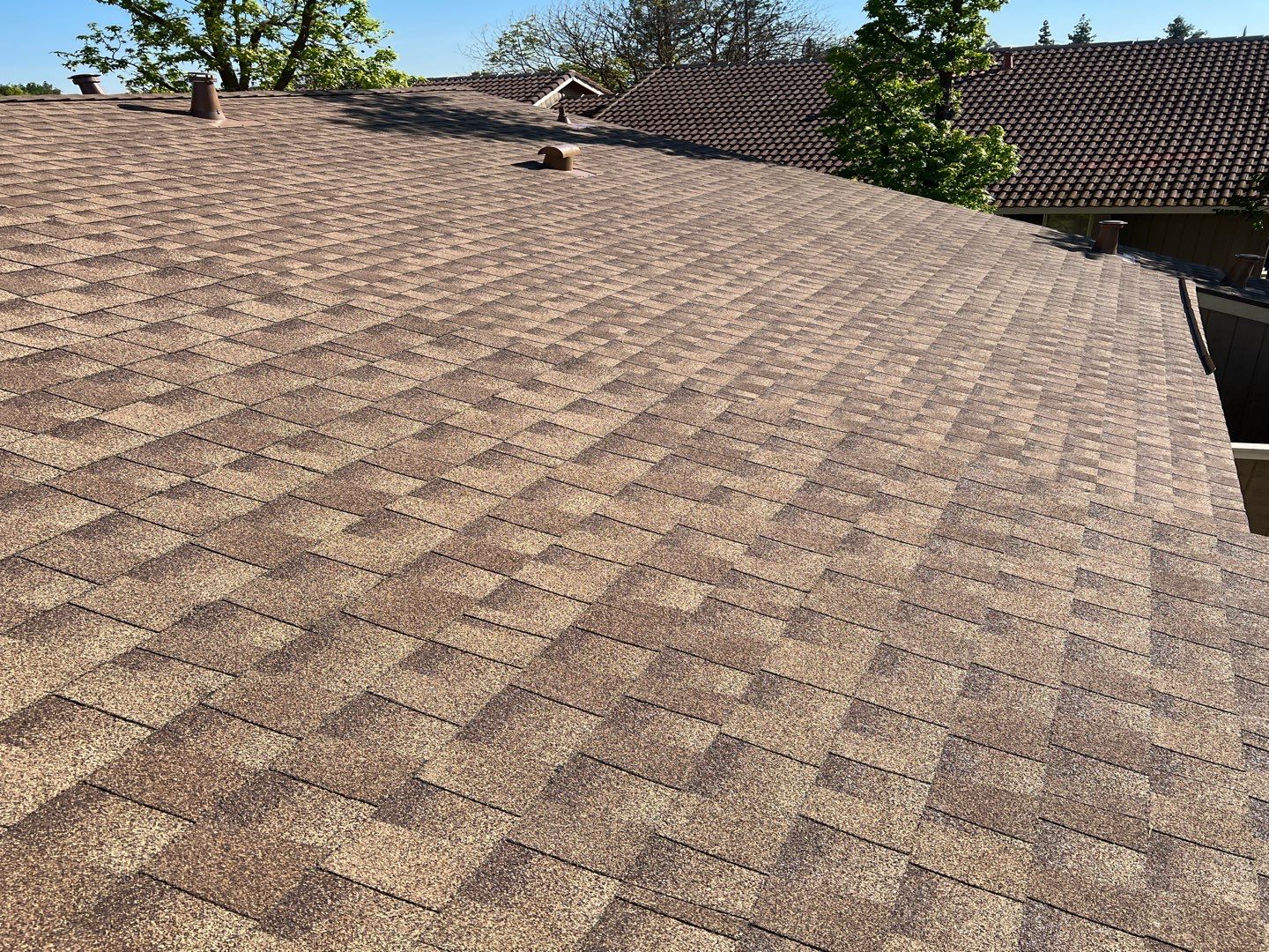 Removed tile from roof and replaced with shingles by Straight Edge Roofing Inc