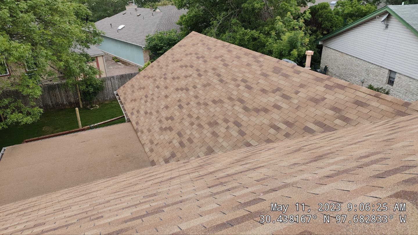 New Roof Installation Of IKO Dynasty Color Brownstone by DeZign Roofing & Exteriors