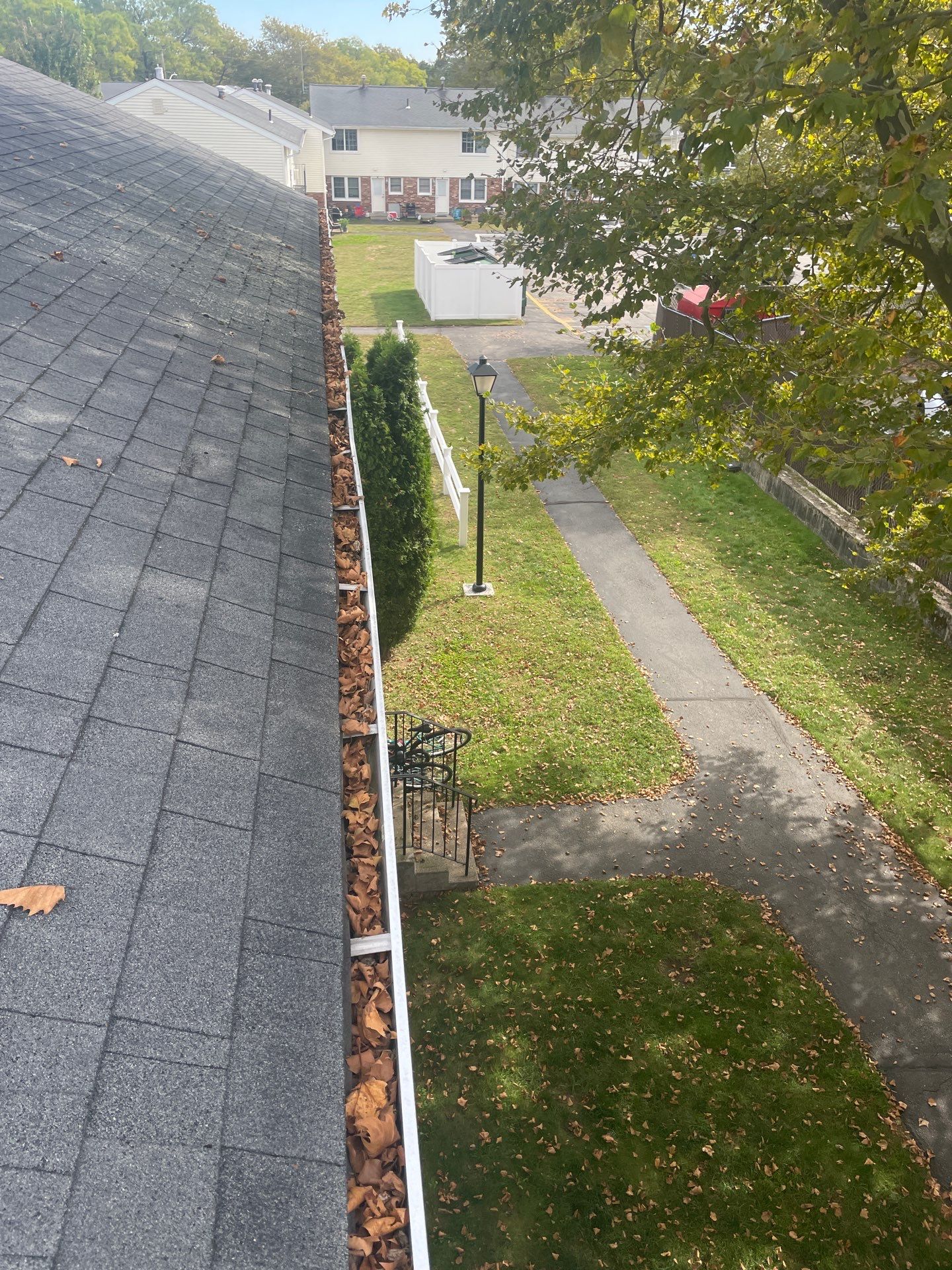 Commercial gutter cleaning Rhode Island before photo with filled gutters