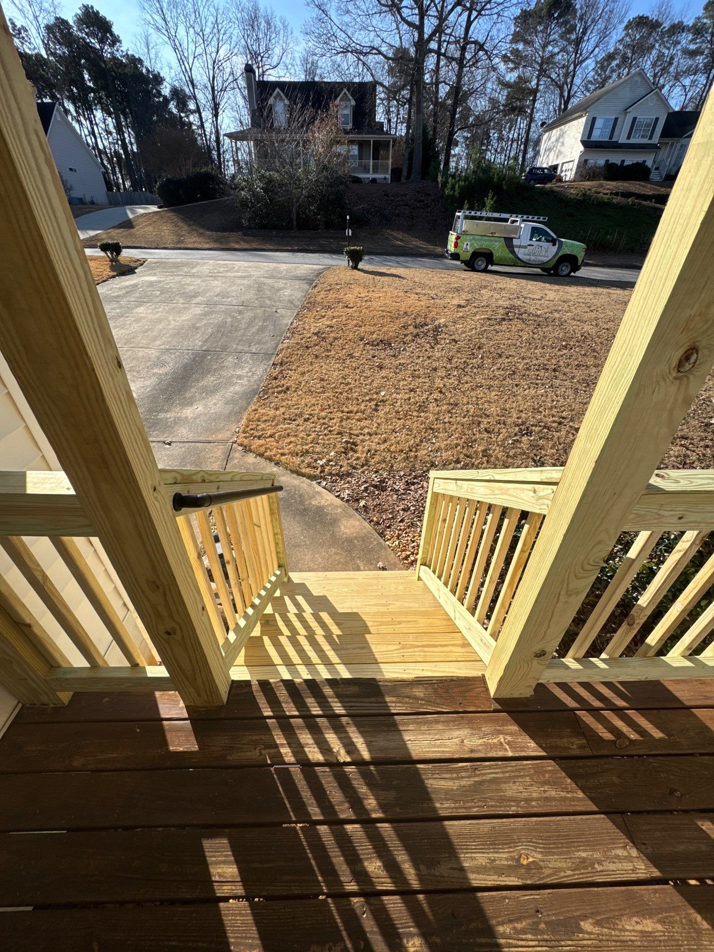 Pressure-Treated Porch Railing and Staircase Upgrade in Cumming by Swift Home Renovations