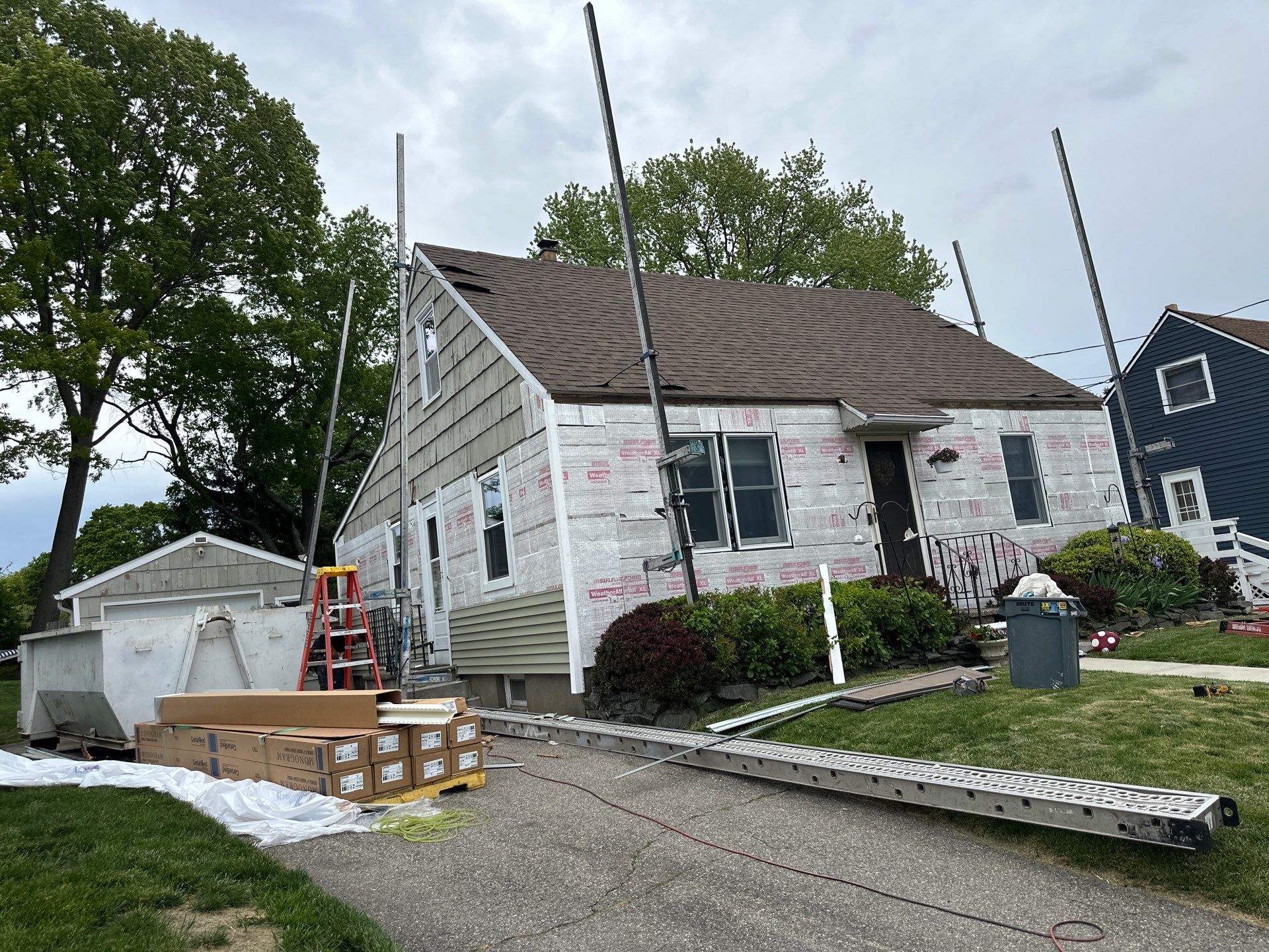 New Vinyl Siding Installation for Milford Home and Detached Garage by A Plus Exterior