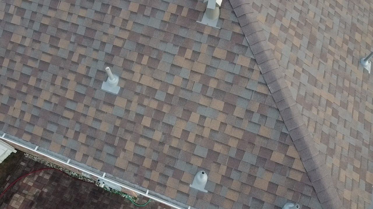 Owens Corning Shingle Roofing Replacement for Houston Two-Story Home by Houston Roofing & Construction