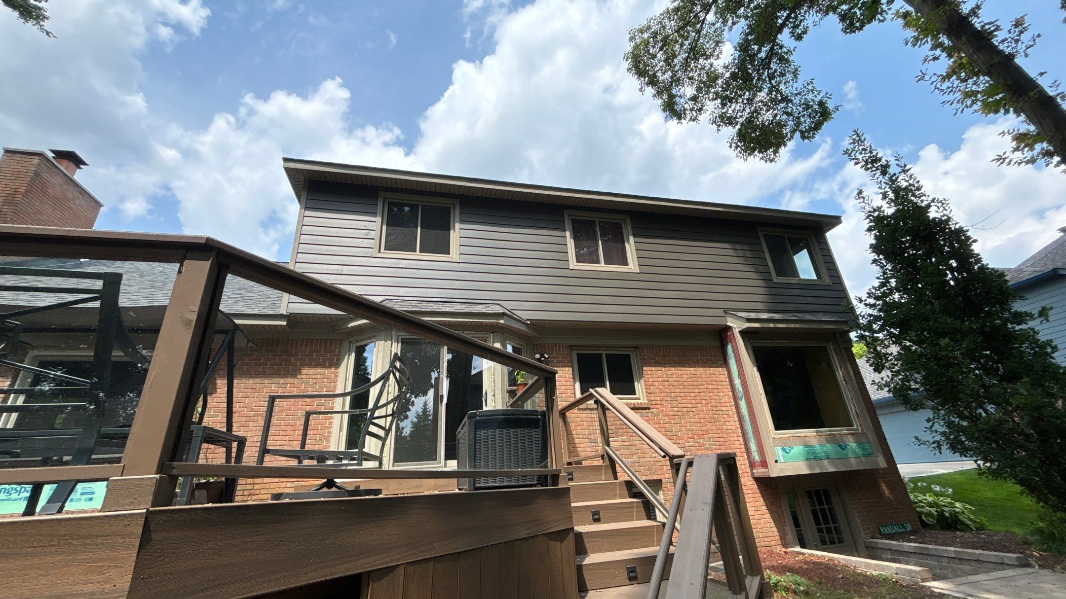Roof Replacement using Owens Corning Peppercorn and Siding Replacement using Ascend Charcoal Smoke by 180 Contractors
