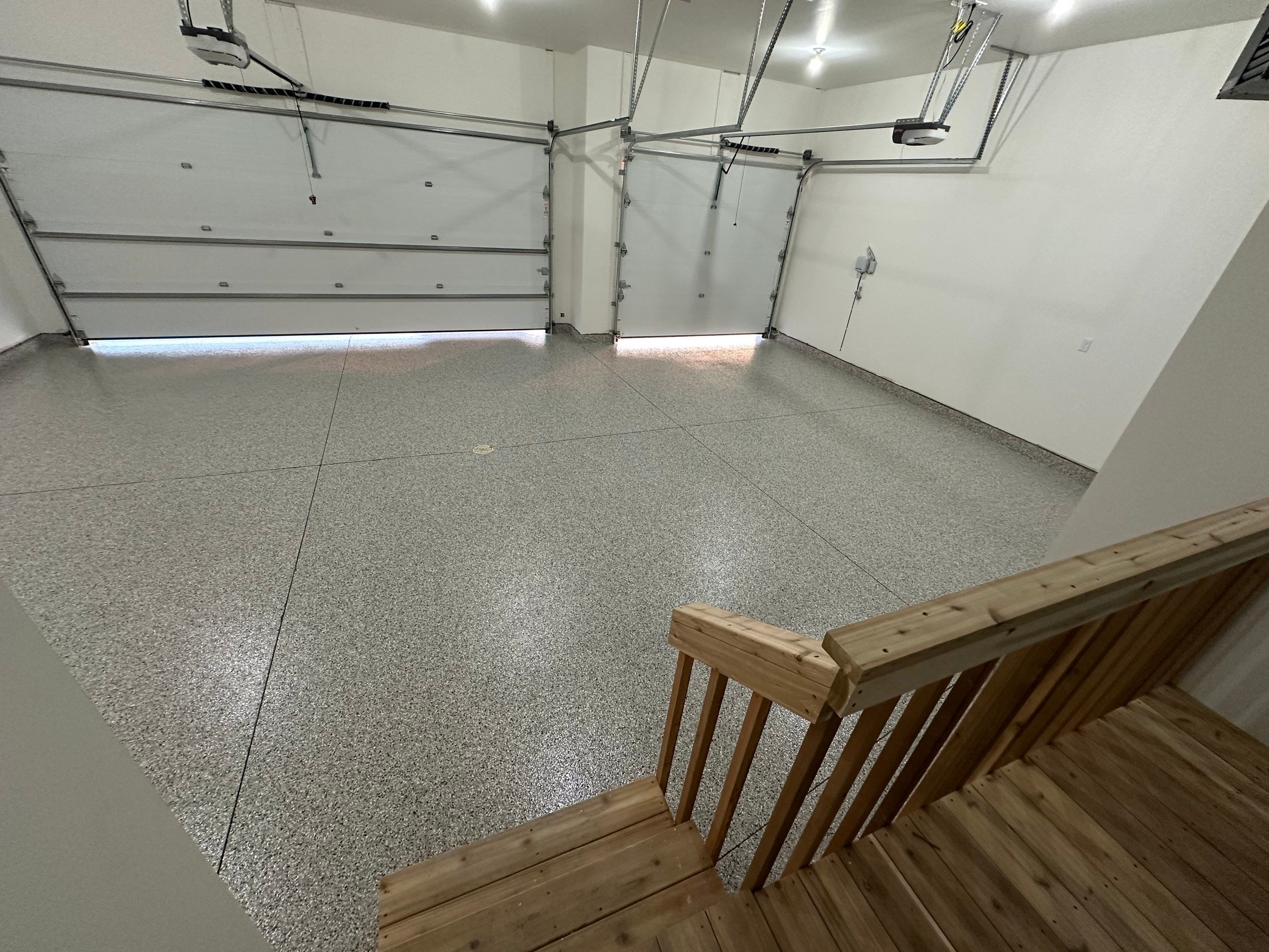Cabin Fever Decorative Flake Garage Floor Coating in Sioux Falls by Select Painting, Coatings & Garage Cabinets