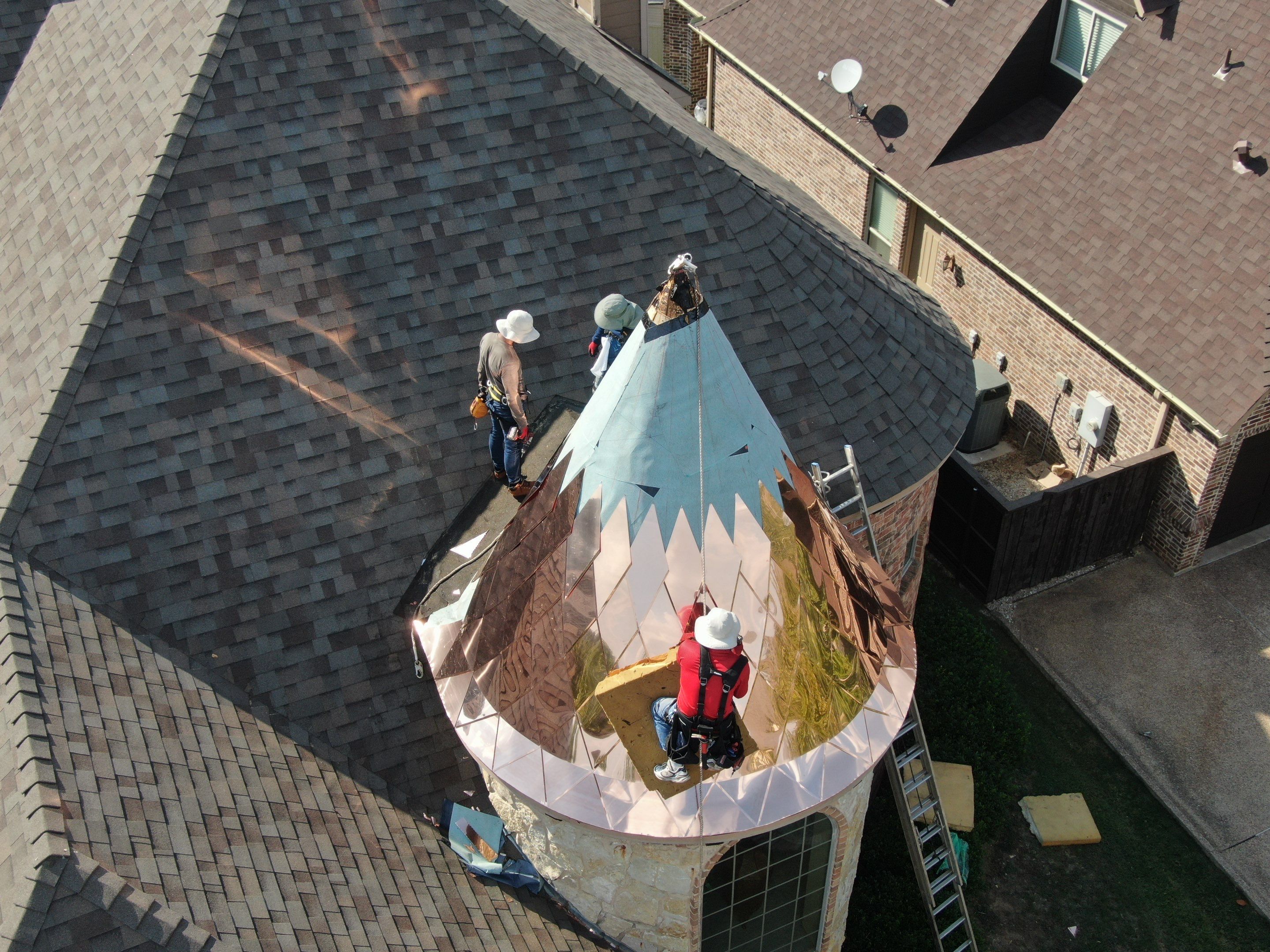 Installing Custom copper turret and Malarkey Vista Class 4 shingles Hail Damage Upgrade by Becker Roofing and Exteriors