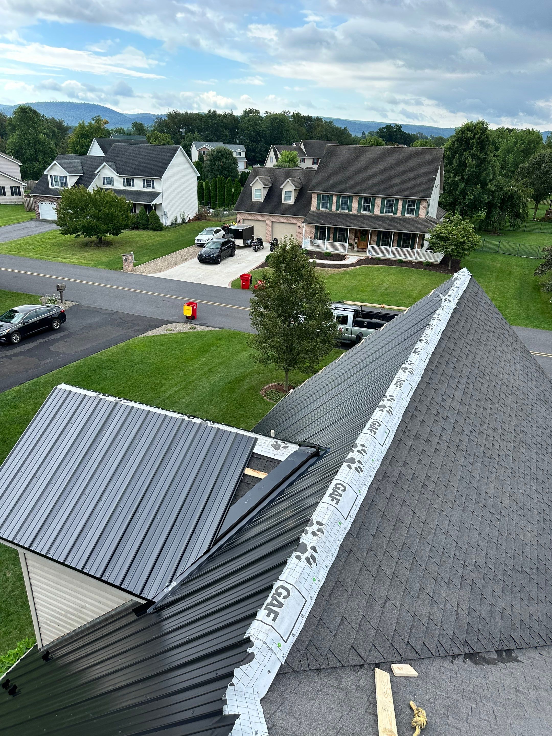 Standing seam / Azm panel in black  by Teflon Roofing
