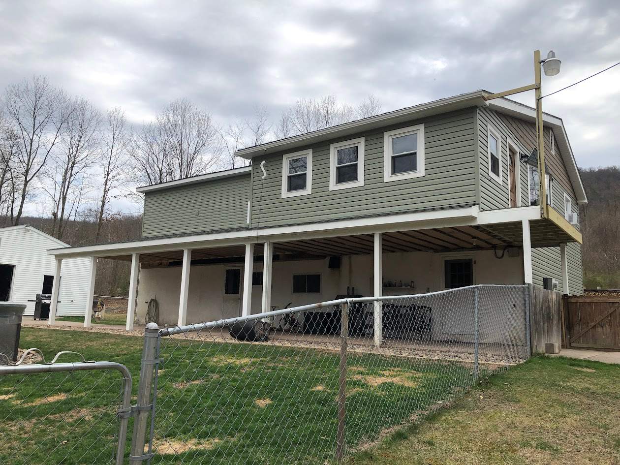 Sage Green Vinyl Siding and Exterior Trim Replacement in Ashland by Esh Builders