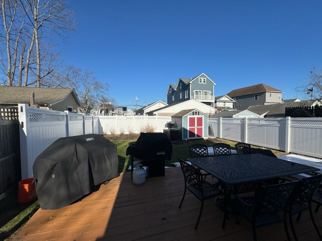 Fence install, White vinyl privacy fence with lattice accent. by DiGiorgi Roofing and Siding Inc