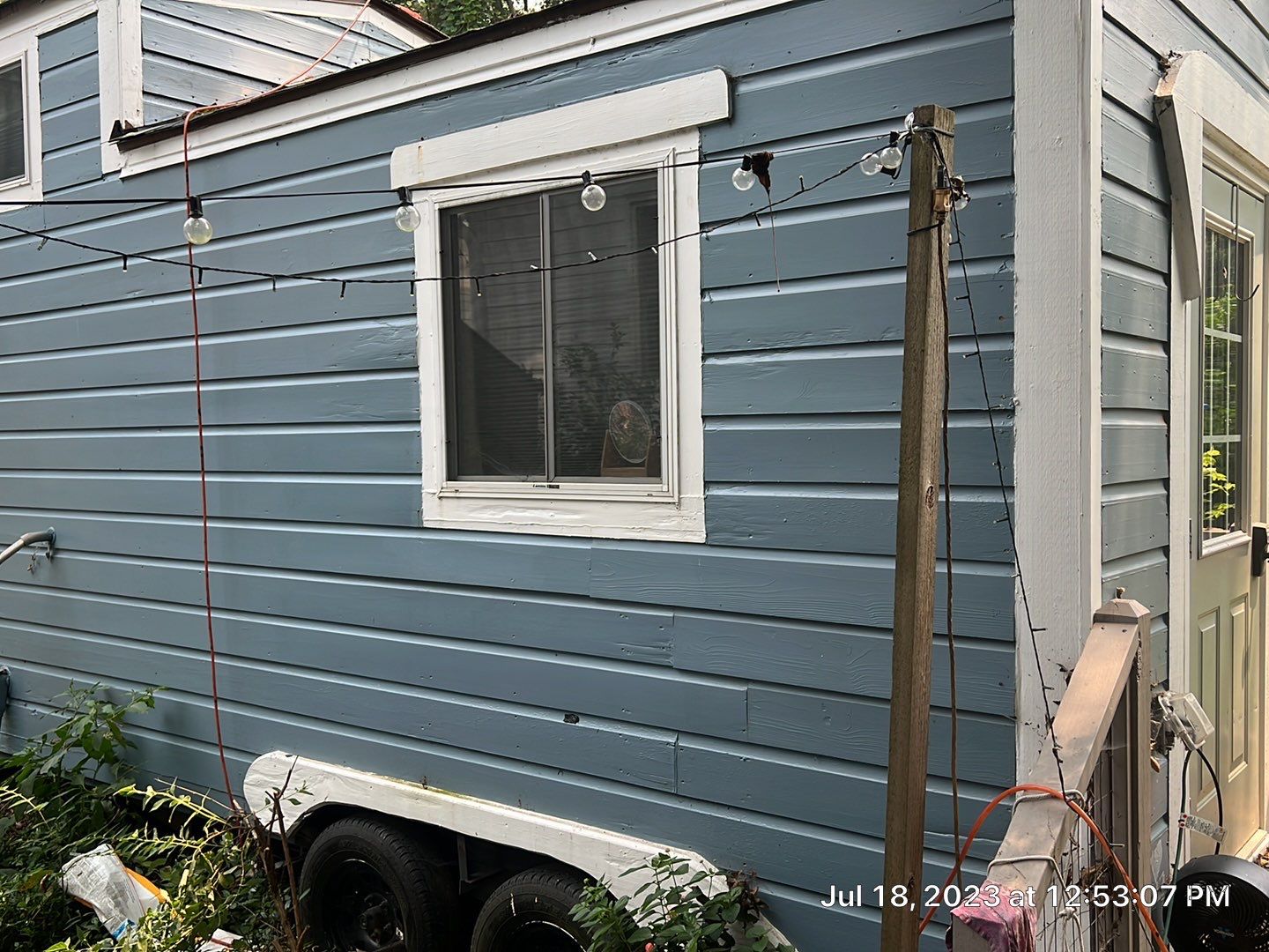 tiny home remodel- siding,paint,roofing by Nailed It Roofing & Remodeling LLC
