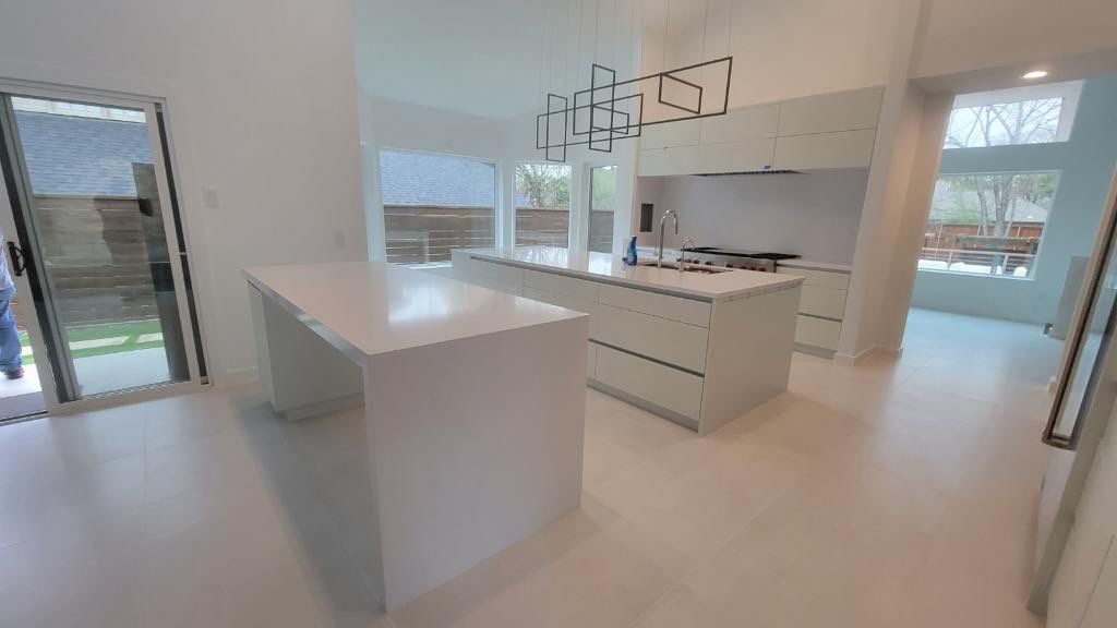Modern & Clean Kitchen by SLM General Contractors & Roofing
