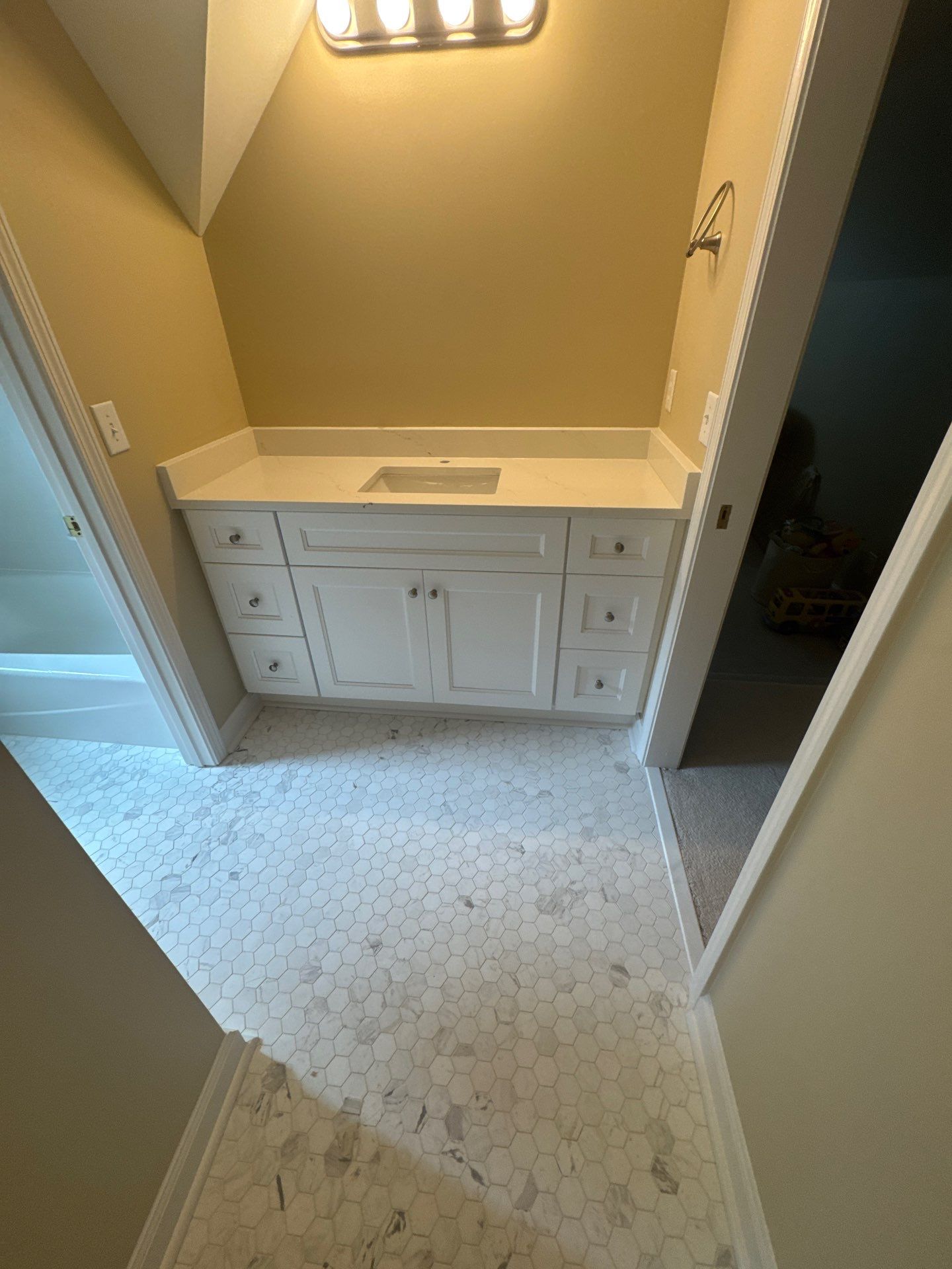 Marietta Bathroom and Laundry Room Floor and Vanity Remodel by Swift Home Renovations