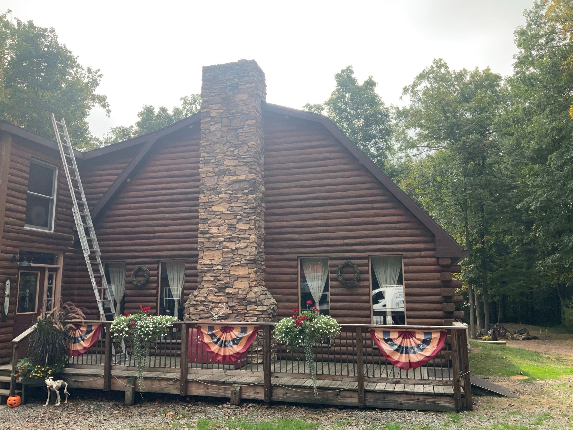 Log Cabin Standing Seam Metal Roof and Skylight Replacement by Esh Builders