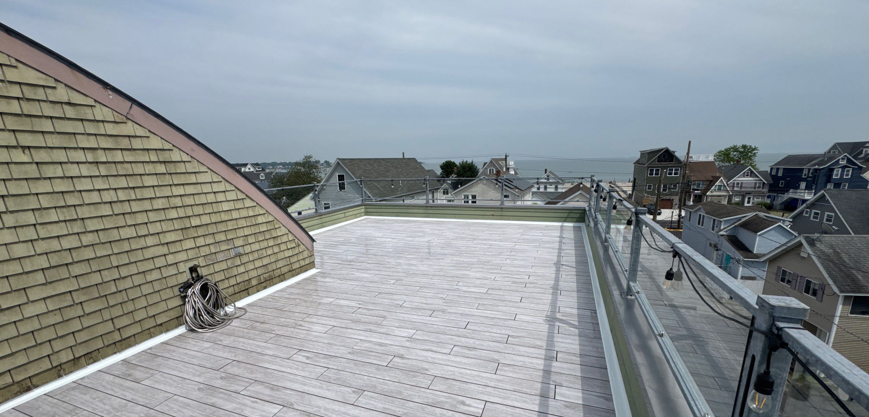 Deck Installation using Tanzite Stone Decking by A Plus Exterior