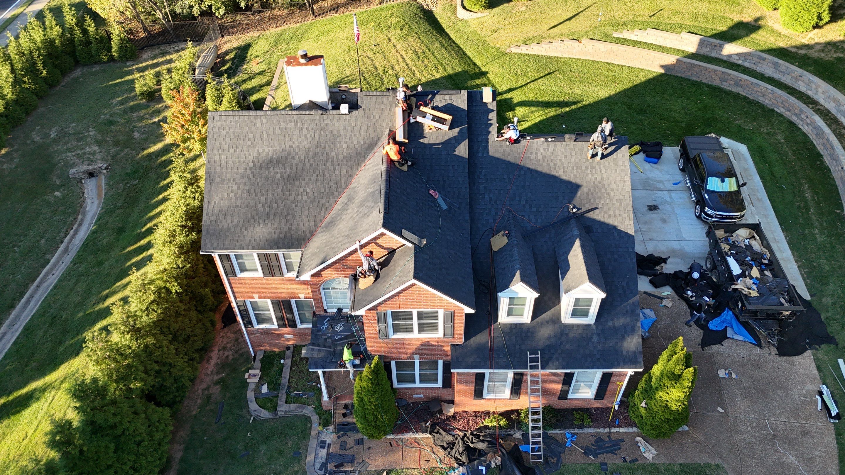 Charcoal Black Re-Roof & Gutters by Royal House LLC