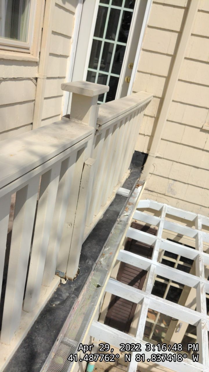 Residential Roofing Installation, Dec-tek walk-out porch roof, siding on garage by Absolute Roofing and Construction