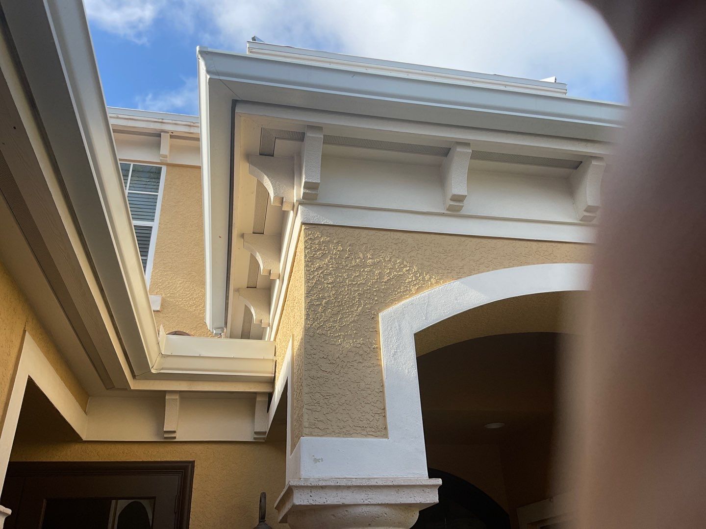 6 Inch Seamless Gutters using White Gutters and Downspouts in Fort Myers FL by Gutter Professors