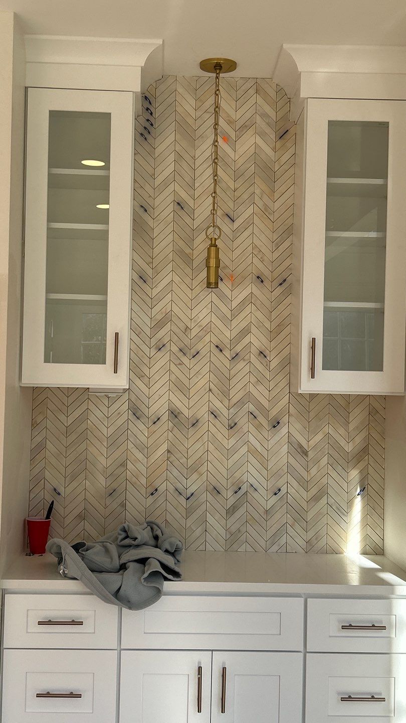 Lovely neutral backsplash  by Footprints Floors of Nashville