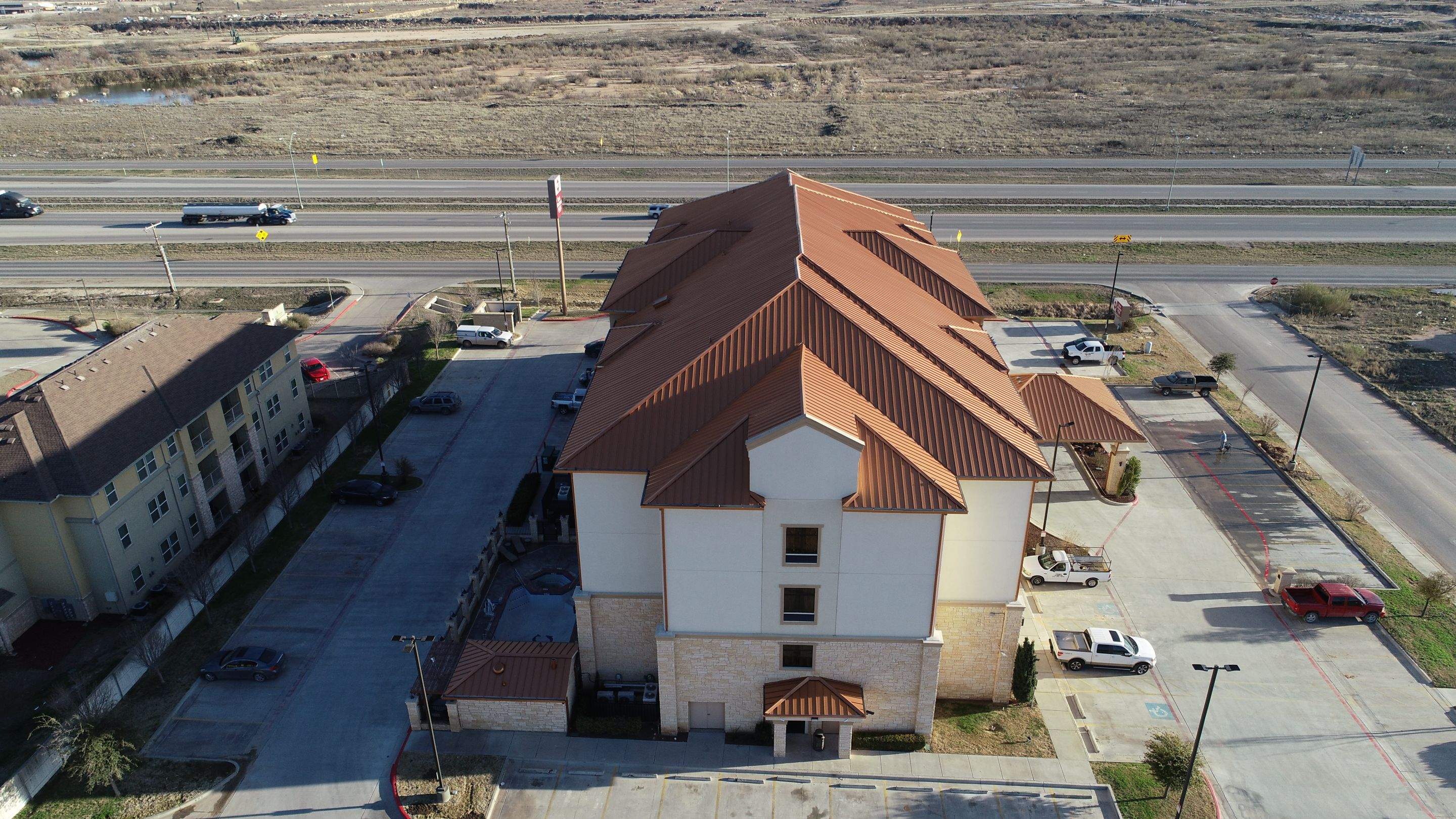 Commercial Roof Replacement for Best Western using Standing Seam Roofing - Midland, TX by Roof Experts