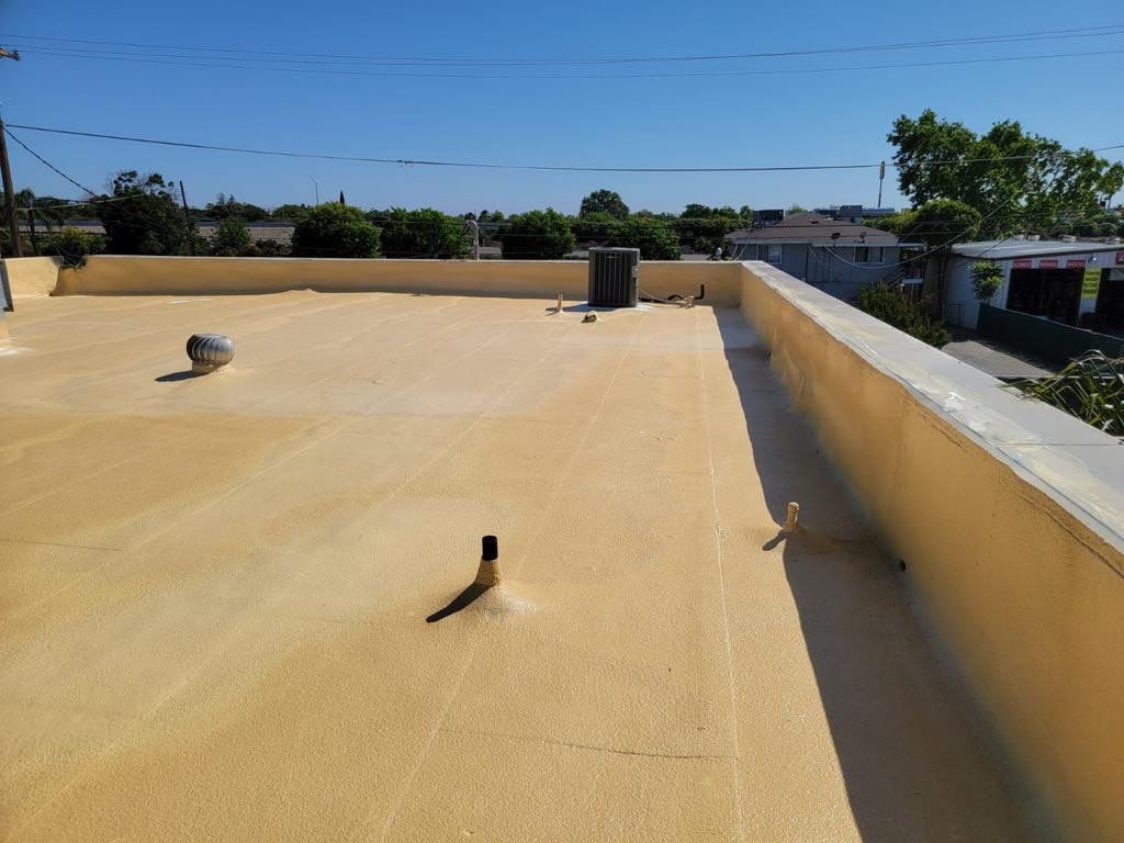 Spray foam and coatings using Conklin Benchmark/PUMA XL coatings and spray foam by Straight Edge Roofing Inc