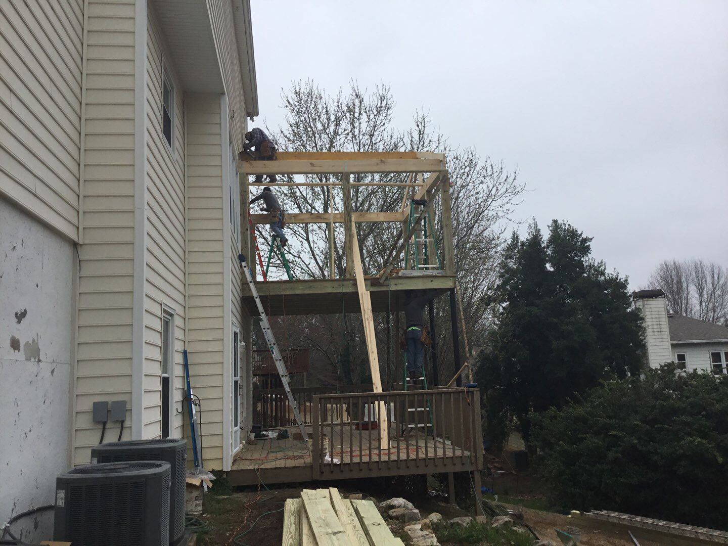Two-Story Pressure Treated Wood Deck and Porch Addition in Marietta by Swift Home Renovations