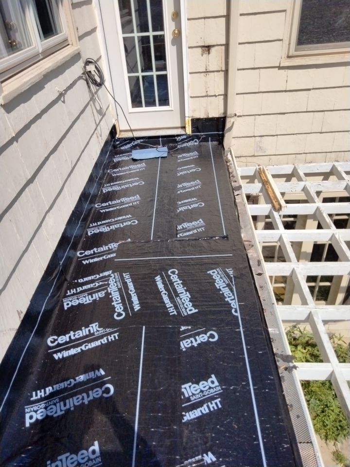 Residential Roofing Installation, Dec-tek walk-out porch roof, siding on garage by Absolute Roofing and Construction