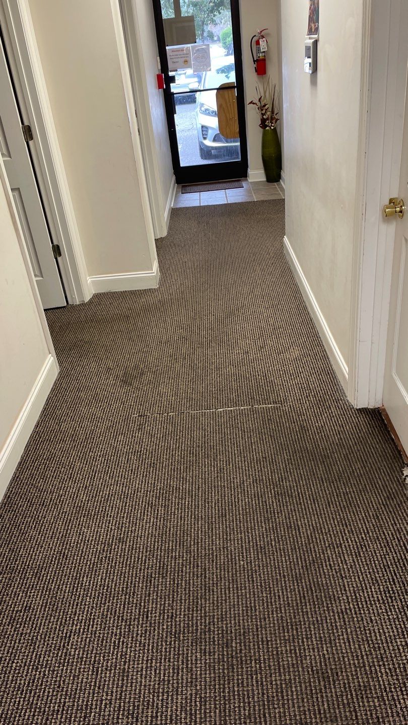 Office Remodel from Worn Out Carpet to Sleek Glued Down LVP by Footprints Floors of Coastal Carolina