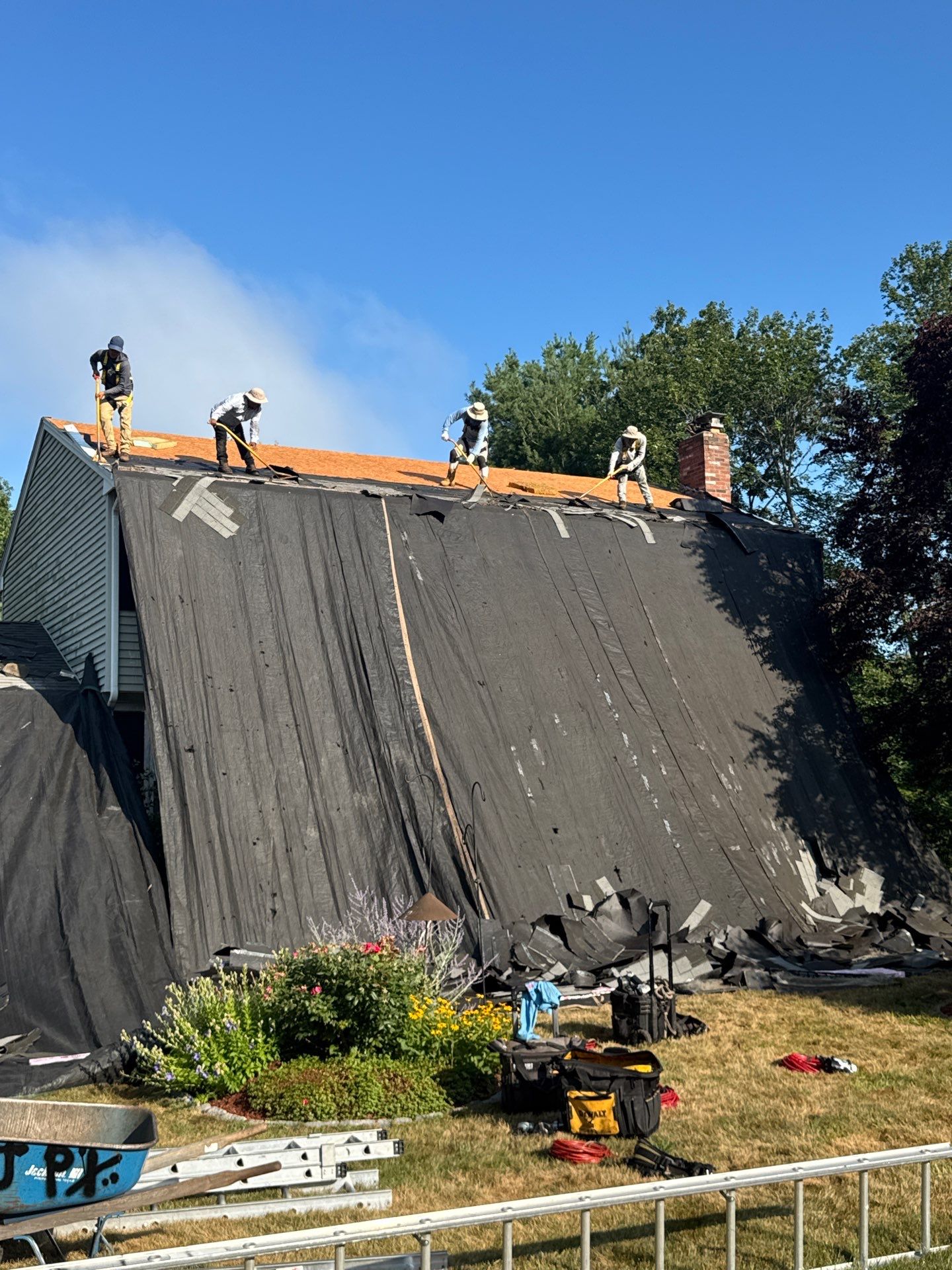 Complete Roof Replacement with Chimney Flashing, Gutter Guard System, and Vinyl Siding Repairs by Mighty Dog Roofing of Greater Middlesex County