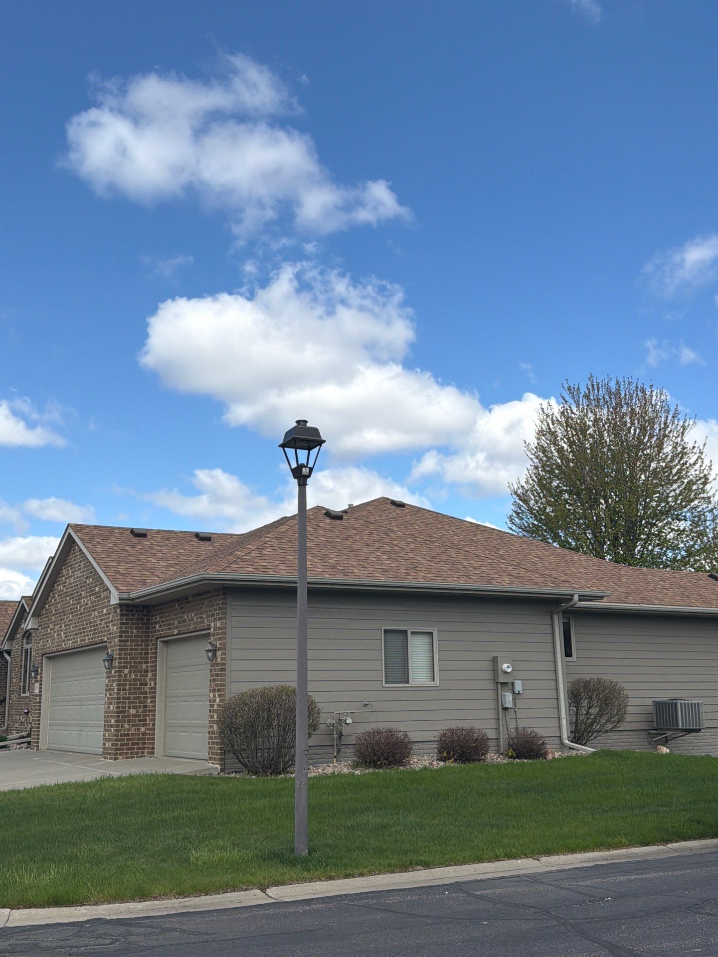 Residential Exterior Siding and Trim Painting in Sioux Falls by Select Painting, Coatings & Garage Cabinets
